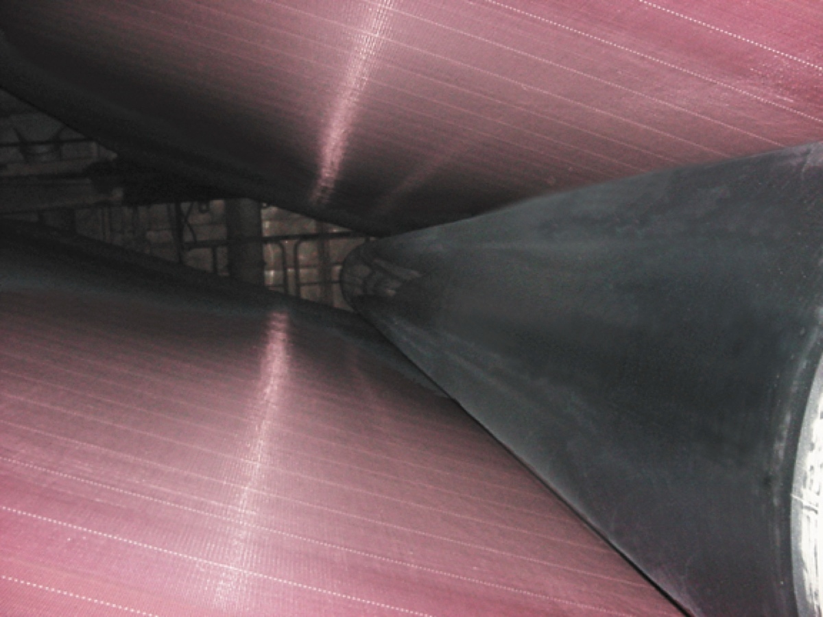 Same paper machine roll running clean after Fluoro-Stat conductive PTFE heat-shrink sleeve install