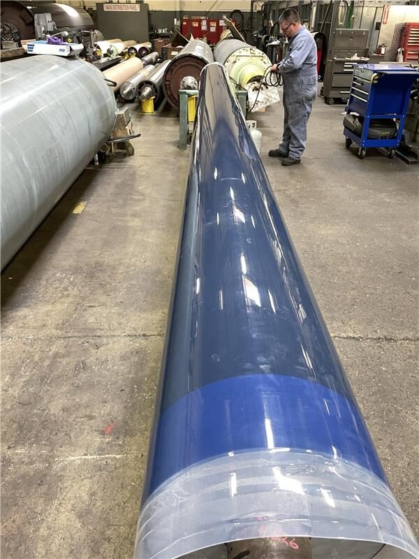 Completed Fluoron heat-shrink fluoropolymer roll cover, ready for service on a production roll.